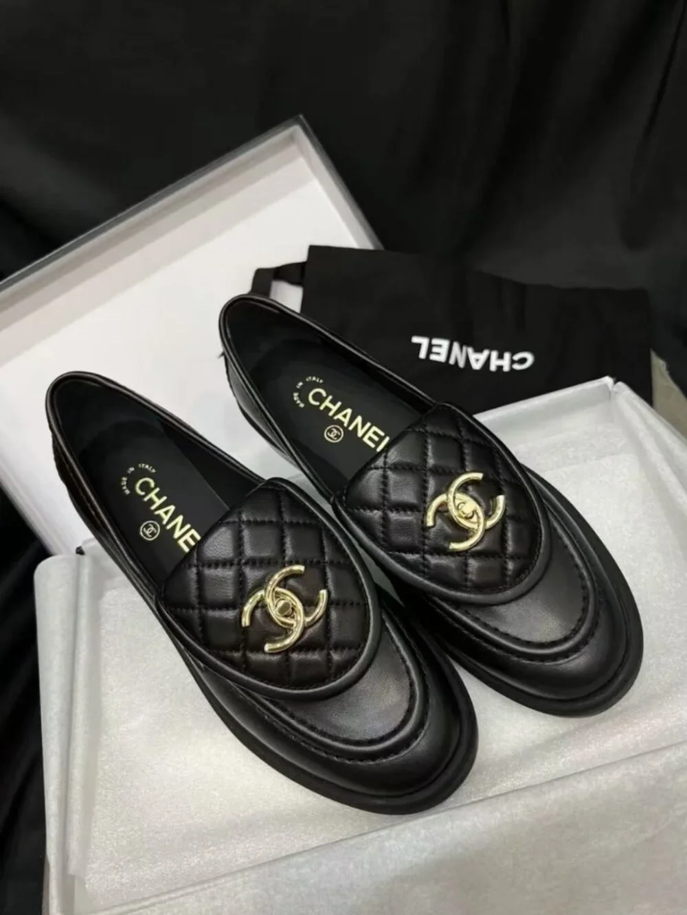 CHANEL black flap‑design loafers